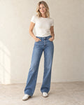 The High-Rise Straight Jean — Mid Blue — studio view
