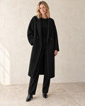 The Longline Textured Coat — Black — studio view