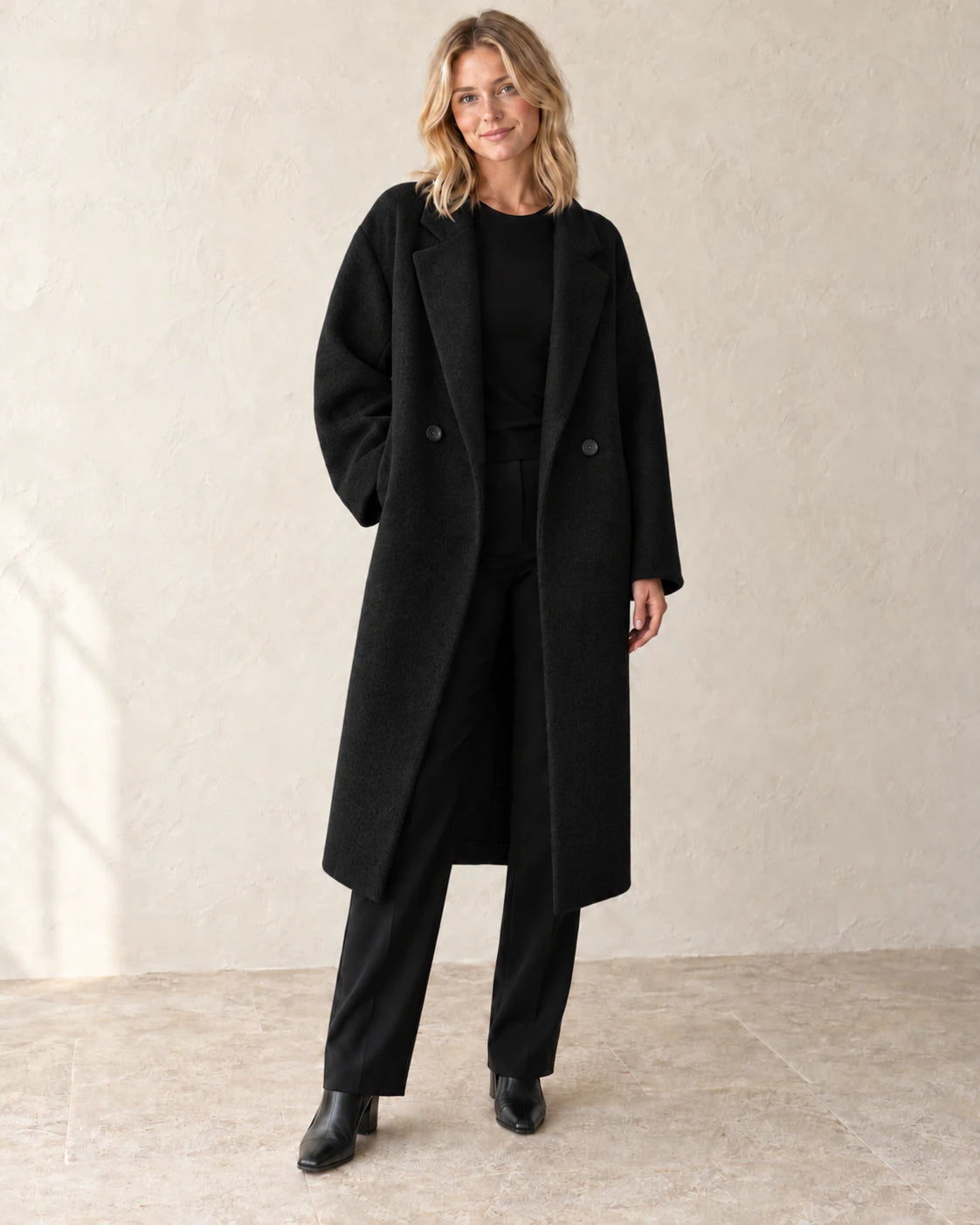 The Longline Textured Coat — Black — studio view