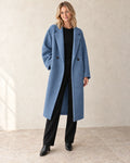 The Longline Textured Coat — Blue — studio view