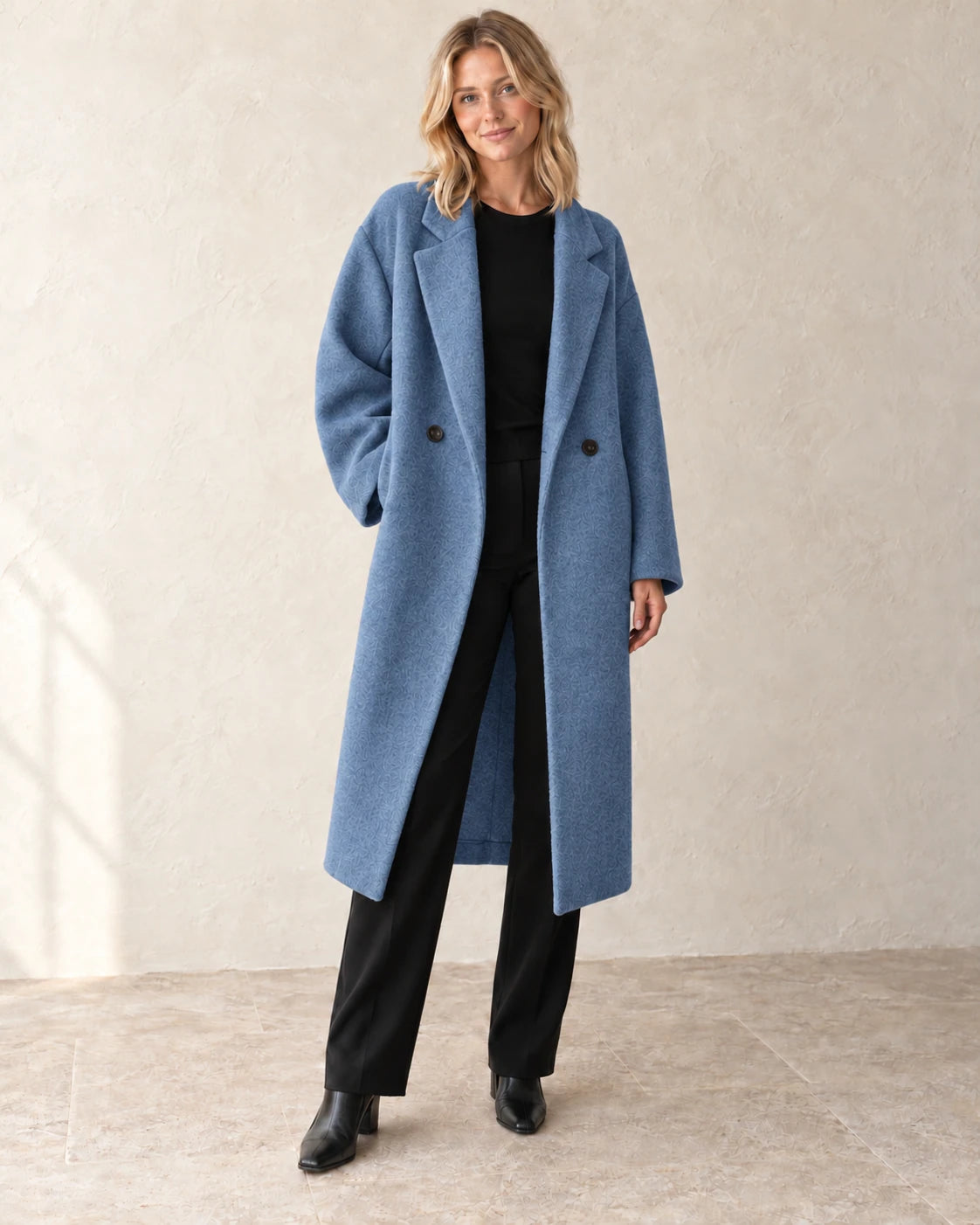The Longline Textured Coat — Blue — studio view