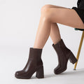 Chocolate ankle boots on model showing the side zip