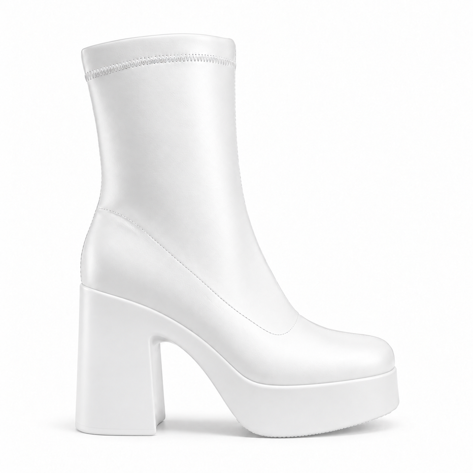 White sculpted platform ankle boots — profile