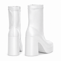 White sculpted platform ankle boots — rear