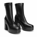 Black sculpted platform ankle boots — hero