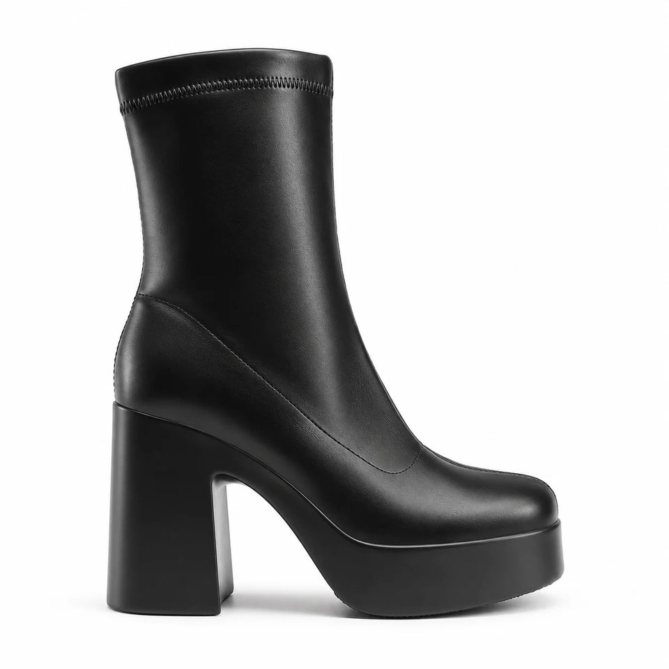 Black sculpted platform ankle boots — profile