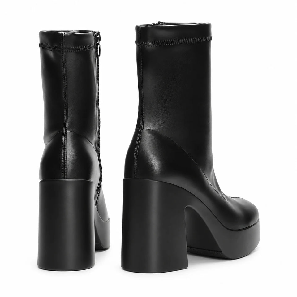 Black sculpted platform ankle boots — rear