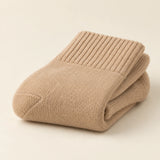 Oat socks folded to show knit texture